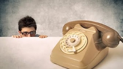 sales rep looking at phone scared